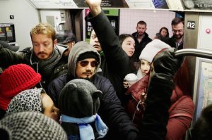 Commuters try to push onto a crowded L train in Brooklyn. AP Photo/Mark Lennihan, File