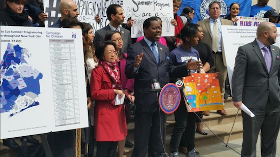 Councilmember Mathieu Eugene (at podium) led a protest rally last month and plans to lead another one for funding for summer programs for the city’s youth. Photo courtesy of Eugene’s office