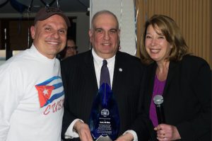 The Brooklyn Bar Association held a surprise party to celebrate the 30th anniversary of its Executive Director Avery Eli Okin (center) last Tuesday. Pictured with Okin is current President Arthur Aidala and past President Andrea Bonina, who both helped to plan the party. Eagle photos by Rob Abruzzese
