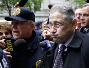 Former Assembly Speaker Sheldon Silver leaves court surrounded by reporters in New York on Tuesday. Silver was sentenced to 12 years in prison, capping one of the steepest falls from grace in the state's lineup of crooked politicians for a consummate backroom dealer who wielded power for over two decades. AP Photo/Seth Wenig