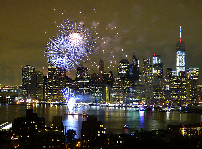 The Macy’s 4th of July Fireworks will once again illuminate the skies over Brooklyn this year, with rockets blasting off from two locations in the East River. Shown: Last year’s fireworks spectacular lit up the skyline south of the Brooklyn Bridge. Photo by Mary Frost