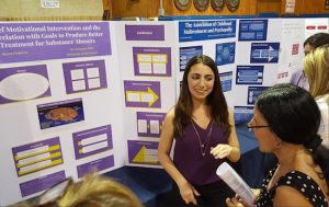 Junior Alyssa Federico explains her research project at the Science Research Symposium. Photo courtesy of Fontbonne Hall Academy
