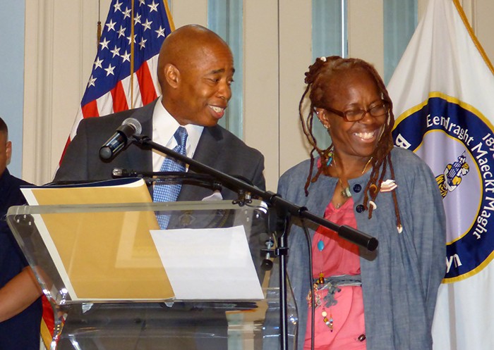 BP Adams shares a lighthearted moment with awardee Rose Graham.