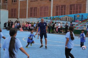 NYCFC defender Jason Hernandez plays with kids from the community on the new state-of-the-art soccer field at P.S. 24.b. Photo courtesy of NYCFC.com