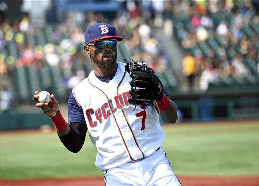 New York Mets' Jose Reyes, playing with the Brooklyn Cyclones, warms up his throwing arm before a minor league baseball game against the Hudson Valley Renegades, Sunday in Brooklyn. Reyes signed a minor league contract with the Mets on Saturday. AP Photo/Kathy Kmonicek