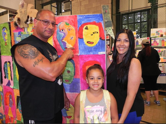 Second grader Jaida Cruz created a first class Picasso-style drawing. Her mom and dad, Valerie and Mike Cruz, like it. Eagle photo by Paula Katinas