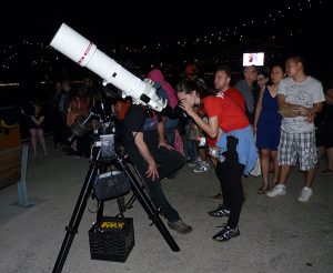 At last year’s World Science Festival, adults and kids alike were amazed to see the four Galilean moons of Jupiter — Io, Europa, Ganymede and Callisto — from Brooklyn Bridge Park. Photo by Mary Frost