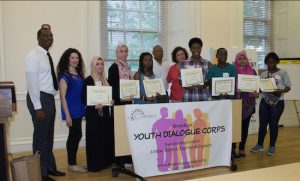 The 2015-16 Brooklyn Youth Dialogue Corps students proudly hold their certificates. Standing in witness with them are Pastor Gilford Monrose (left), youth coordinator/facilitator Daria Somers (second from left), Brooklyn Borough President Eric Adams (center) and Dialogue Project founder Marcia Kannry. Eagle photos by Francesca N. Tate
