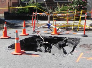The crater on 79th Street is eight feet deep. Eagle photo by Paula Katinas