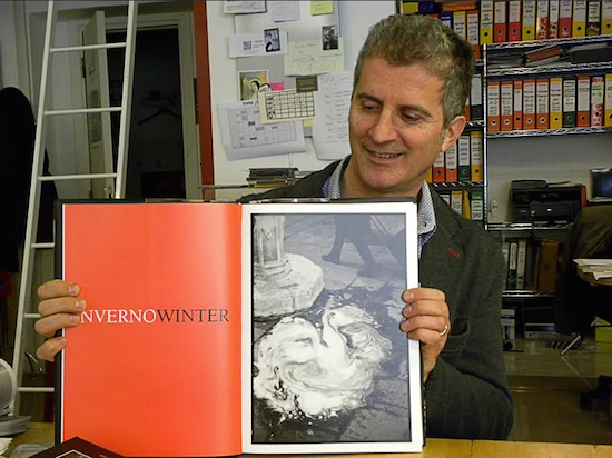 Claudio Corrivetti with "Venice/Venezia," the photography book Corrivetti and Freed produced in 2004. Eagle photo by Palmer Hasty