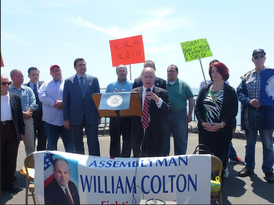 Assemblymember William Colton (at podium) leads a rally against the marine transfer station. Photo courtesy of Colton’s office