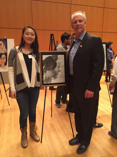 Carrie Guan shows her artwork to U.S. Rep. Dan Donovan at the U.S. Capitol. Photo courtesy of Bishop Kearney High School