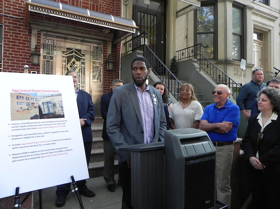 Councilmember Jumaane Williams (at podium) is among the lawmakers pushing legislation to crack down on illegal homes. At right are Bob Cassara, founder of the Brooklyn Housing Preservation Alliance, and Fran Vella-Marrone, president of the Dyker Heights Civic Association. Eagle file photo by Paula Katinas