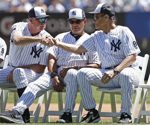 Brooklyn native and former Yankees manager Joe Torre, right, sits during pregame introductions before the Yankees annual Old Timers Day baseball game on June 16. Today is Torre's birthday. AP Photo/Kathy Willens