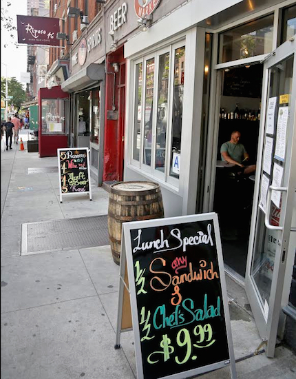 New York City is pushing businesses to cool it this summer. Under a newly expanded law, most stores and restaurants could be fined $250 or more if they keep doors or windows open while running A/C. AP Photo/Bebeto Matthews
