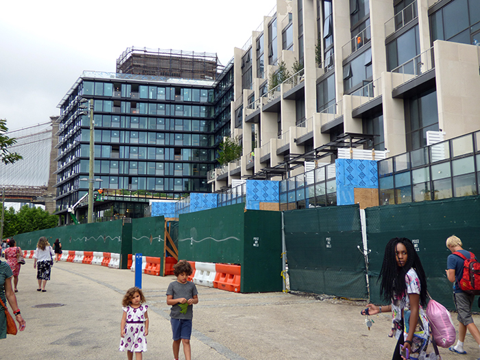 The controversial Pierhouse hotel/condo complex in Brooklyn Bridge Park is not yet completed, but a report of a possible sale of the hotel portion, shown above on the left, has piqued the interest of residents of Brooklyn Heights. Photo by Mary Frost