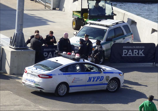 Neighborhood policing is expanding to more Brooklyn precincts, including the 84th, which encompasses Brooklyn Bridge Park (where police officers are shown in the above photo), Brooklyn Heights and DUMBO. Eagle file photo by Mary Frost