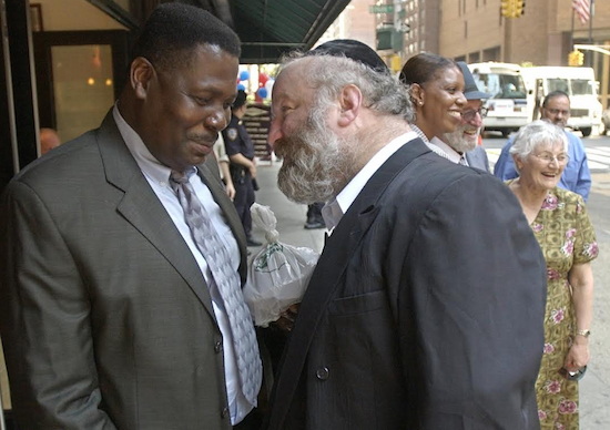 Carmel Cato, left, and Norman Rosenbaum are pictured in August 2003 in New York. Cato and Rosenbaum — both of whom lost family members in the riots — have different opinions on the upcoming festival that will commemorate the 25th anniversary of the violent events. AP Photo/Julie Jacobson
