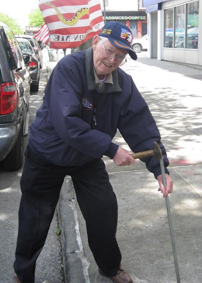 Howard Dunn, a World War II veteran, became famous in Bay Ridge for planting thousands of American flags on sidewalks. Photo courtesy of Raymond Aalbue