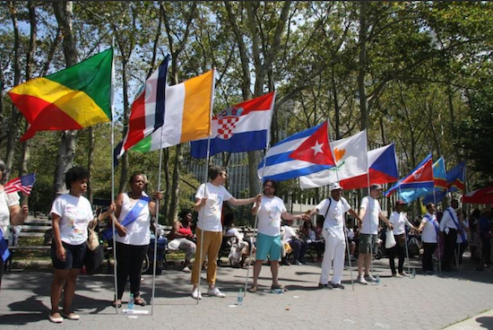 Last year’s Unity Parade of Flags delegates hold hands as they encircle Cadman Plaza Park. Photo: Stefan Ringel/Brooklyn BP’s Office