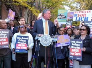 Mayor Bill de Blasio, who supported the idea of saving Long Island College Hospital (LICH) while running for Mayor (as seen above), says the city will cooperate with an investigation over his support of the sale of the hospital to developer Fortis. Photo by Mary Frost