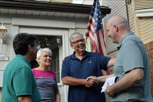 District leader candidate Chris McCreight (right) and Councilmember Vincent Gentile (left) talk to a Dyker Heights couple while campaigning earlier this month. McCreight says he has knocked on 14,000 doors of voters during the campaign. Photo courtesy of McCreight’s campaign