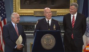 Bill Bratton (left) will be stepping down as Police Commissioner in September, to be replaced by Brooklyn native Jimmy O’Neill (center). Mayor Bill de Blasio is shown right.  Photo courtesy NYC screen grab