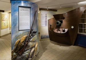 An interactive Old Stone House exhibit showing an actual rifle used by the First Maryland Regiment in August 1776. Photos by Etienne Frossard