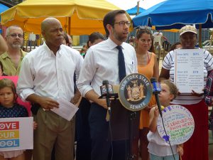 State Sen. Daniel Squadron (center), Borough President Eric Adams (left) and community members made a push on Thursday to keep the Pop-Up Pool in Brooklyn Bridge Park open until plans are in place for a replacement pool. Eagle photo by Mary Frost