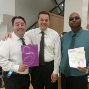 Craig DiMonda (left), assistant store manager of Macy’s Kings Plaza, John Quaglione (center) and Gerard Guichard, Macy’s Kings Plaza store manager, join forces to promote the “Shop for a Cause” fundraising event. Photo courtesy of Quaglione