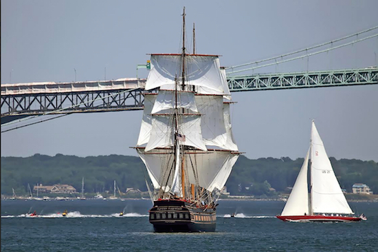 In this July 2016 photo, the SSV Oliver Hazard Perry sails beside the yacht American Eagle, right, and a group of jet skiers in Rhode Island's Narragansett bay. George Bekris/OHPRI via AP
