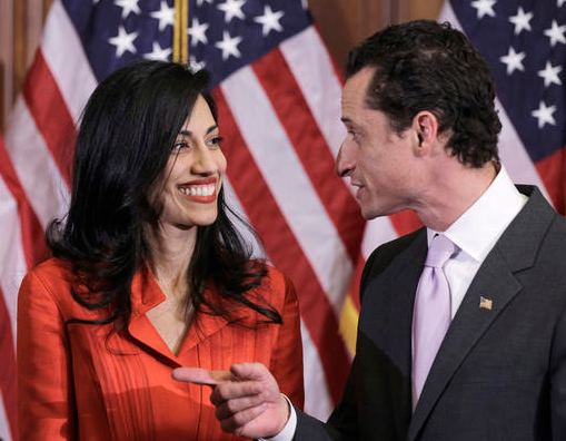 In this photo taken Jan. 5, 2011, then-New York Rep. Anthony Weiner and his wife, Huma Abedin, an aide to then-Secretary of State Hillary Clinton, are pictured after a ceremonial swearing in of the 112th Congress on Capitol Hill in Washington. Democratic presidential candidate Hillary Clinton aide Huma Abedin says she is separating from husband Anthony Weiner after another sexting revelation involving the former congressman from New York. AP Photo/Charles Dharapak