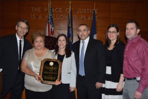 The Kings County Supreme Court held a tribute ceremony for the late Justice Arthur Schack on Wednesday, presenting his family with a plaque to commemorate his time as a judge. Pictured from left: Hon. Lawrence Knipel, Dilia Schack, Elaine Schack-Rodriguez, Douglas Schack, Gina Schack and Todd Blanchard. Eagle photos by Rob Abruzzese