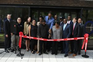 Officials, including Councilmember Robert Cornegy Jr., (center, rear) and Bedford-Stuyvesant Restoration president/CEO Colvin Grannum (front, third from right), participated in the ribbon-cutting for the new Economic Solutions Center at Restoration Plaza. Photos: Margot Jordan/Courtesy Bedford Stuyvesant Restoration Corporation