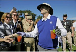 FILE - In this Feb. 10, 2016, file photo, Bill Murray hands out Bloody Mary cocktails to fans on the 17th tee of the Pebble Beach Golf Links during the celebrity challenge event of the AT&T Pebble Beach National Pro-Am golf tournament in Pebble Beach, Calif. Time Out New York reports Murray will tend bar at his son's Brooklyn restaurant on Sept. 16 and Sept. 17, 2016. AP Photo/Eric Risberg, File