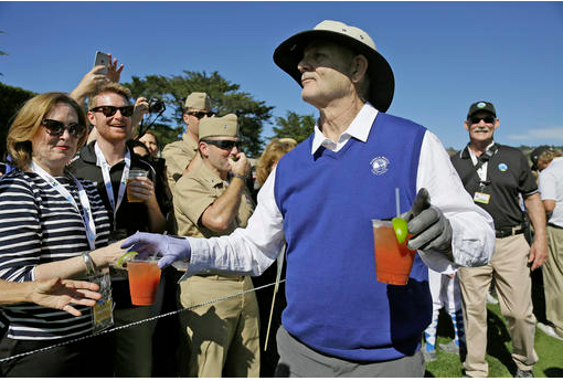 FILE - In this Feb. 10, 2016, file photo, Bill Murray hands out Bloody Mary cocktails to fans on the 17th tee of the Pebble Beach Golf Links during the celebrity challenge event of the AT&T Pebble Beach National Pro-Am golf tournament in Pebble Beach, Calif. Time Out New York reports Murray will tend bar at his son's Brooklyn restaurant on Sept. 16 and Sept. 17, 2016. AP Photo/Eric Risberg, File