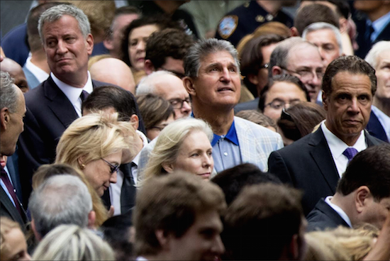 Gov. Andrew Cuomo (right) signed a bill into law aimed at helping first responders and World Trade Center volunteers. He attended the Sept. 11 ceremony with other dignitaries, including Democratic presidential candidate Hillary Clinton, Mayor Bill de Blasio, U.S. Sen. Kirsten Gillibrand (D-N.Y.) and U.S, Sen. Joe Manchin, (D-W.Va.). AP photo/Andrew Harnik