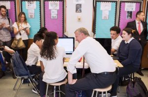 City schools will be partnering with library systems, Google and Sprint to offer free Wi-Fi hotspots to high-needs public school students and families. Shown above: Mayor Bill de Blasio, speaking with students at a recent technology-related event. Photo by Michael Appleton