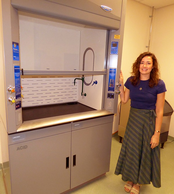 Science teacher Kassidy Loy shows off the science lab’s fume hood.