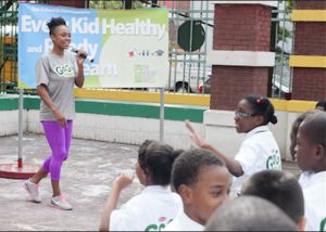 Olympic Gold Medalist and GoGo squeeZ Goodness Ambassador Dominique Dawes discusses the importance of living a healthy and active lifestyle with fifth grade students during an event at P.S.6 in Flatbush. Photos by Phillip Reed