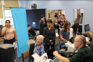 Schools Chancellor Carmen Fariña waits her turn at the pop up IDNYC center at Fort Hamilton High School on Wednesday. Photos courtesy of Mayor’s Office of Immigrant Affairs