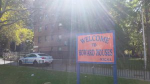 An NYPD cruiser patrols the Howard Houses in Brownsville, where State Sen. Jesse Hamilton and others witnessed the fatal shooting of a 28-year-old man in broad daylight Wednesday afternoon. Eagle photo by James Harney