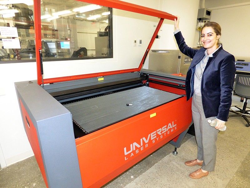 MakerSpace manager Victoria Bill shows the department’s largest laser cutter. Photo by Mary Frost