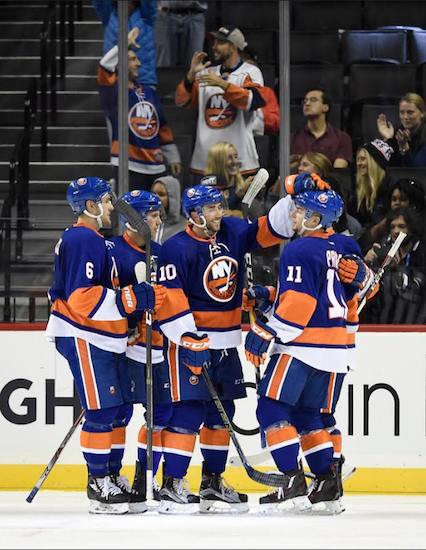 Shane Prince (far right) accepts congratulations after scoring in the third period of the Islanders’ 3-0 exhibition victory over the Philadelphia Flyers at Downtown’s Barclays Center on Monday night. AP photo