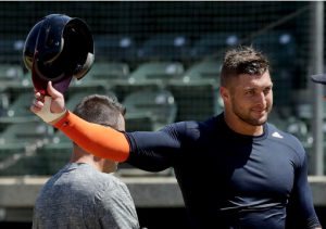 FILE - In this Aug. 30, 2016, file photo, former NFL quarterback Tim Tebow finishes his work out for baseball scouts and the media in Los Angeles. Tebow has signed a minor league contract with the New York Mets. The Mets announced Thursday, Sept. 8, 2016, that the former quarterback will take part in the Instructional League in Port St. Lucie, Florida. AP Photo/Chris Carlson, File