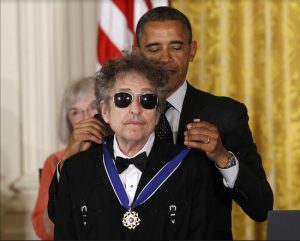 In this May 2012 file photo, President Barack Obama presents music legend Bob Dylan with a Medal of Freedom during a ceremony at the White House in Washington, D.C. On Oct. 13, it was announced that Dylan won the 2016 Nobel Prize in Literature. AP Photo/Charles Dharapak, File