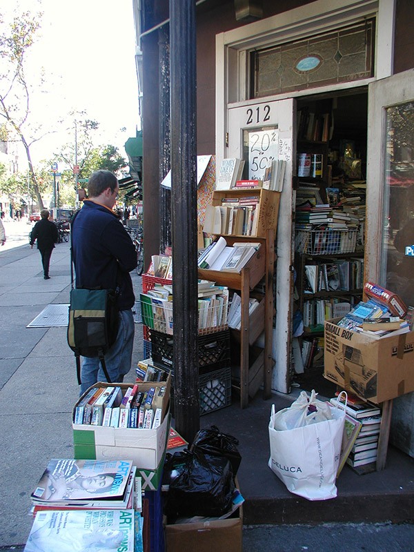 A passerby browses some books on display outside the shop.  Eagle file photo