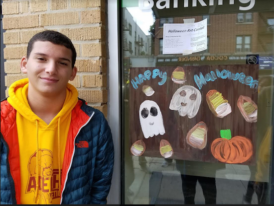 Adelphi Academy student Jade Beltre looks like she’s having fun painting the window of Casa Calamari on Third Avenue. Photos courtesy of Adelphi Academy of Brooklyn
