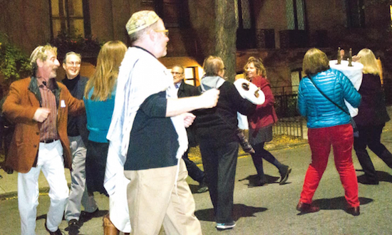 Rabbi Serge Lippe (foreground left), guest dance leader Steven Weintraub and Cantor Bruce Ruben (both in background, left) dance with the Brooklyn Heights Synagogue. Heights Press photos by Francesca N. Tate