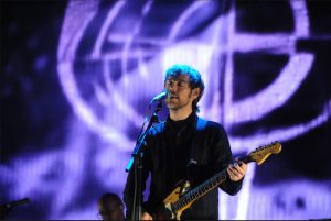 Aaron Dessner, seen here performing with  the National, his indie rock band, has sold his Victorian Flatbush house and recording studio. Photo by Robb D. Cohen/Invision/AP